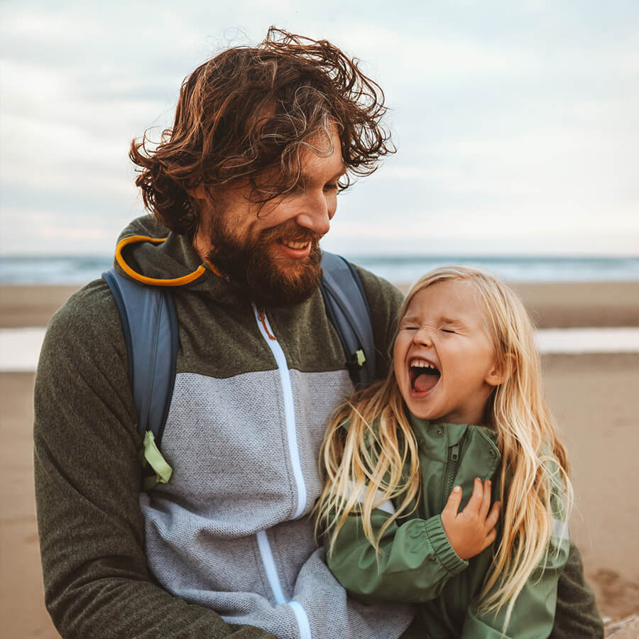 A father and daughter at the beach