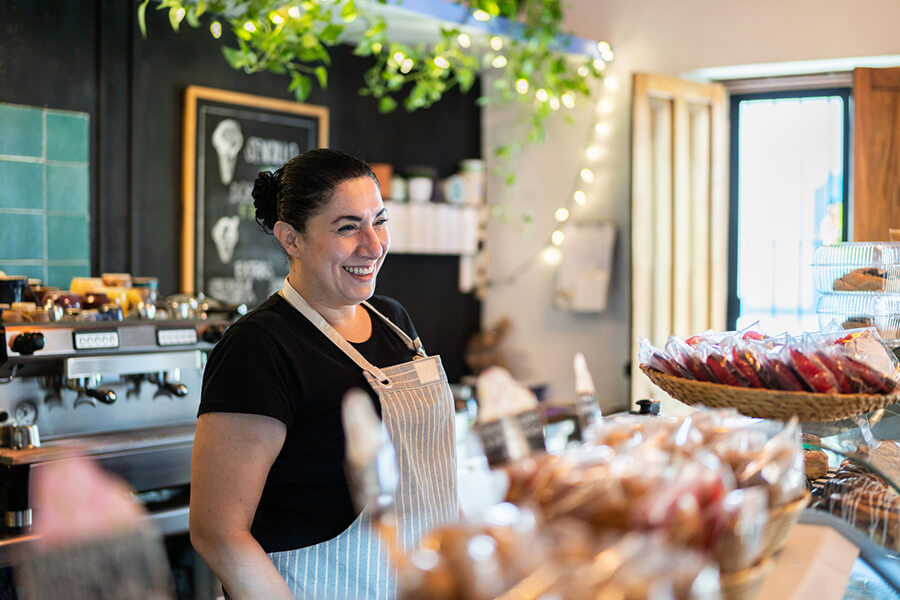 Baker at her store behind the counter