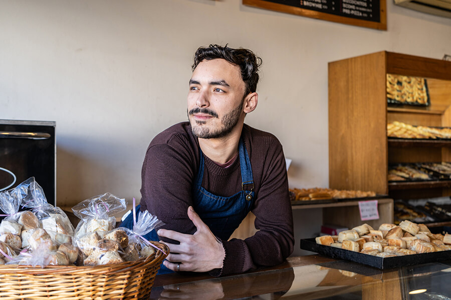 Bakery owner waits at counter