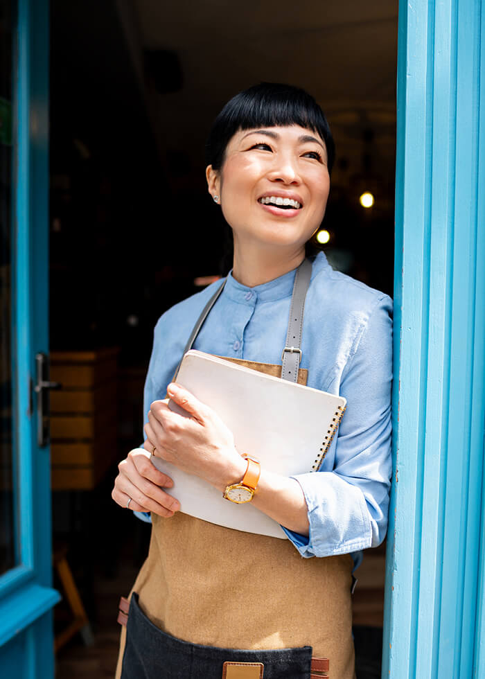 Female business owner in entryway