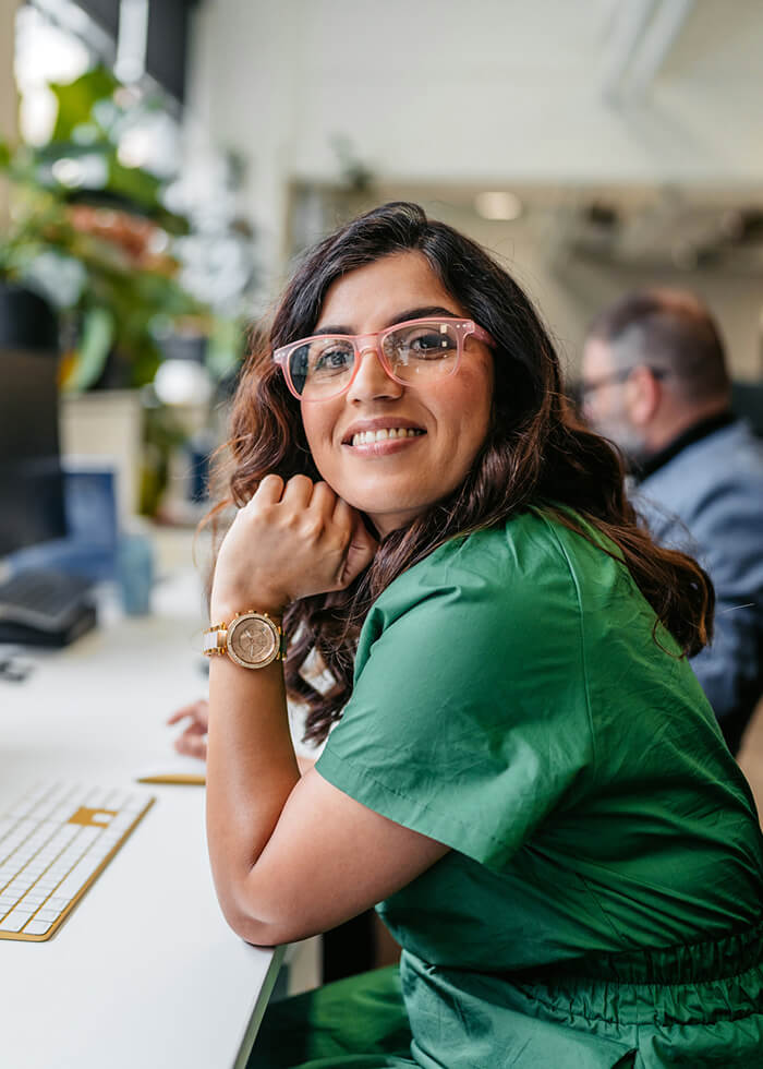 Happy employee looking at camera