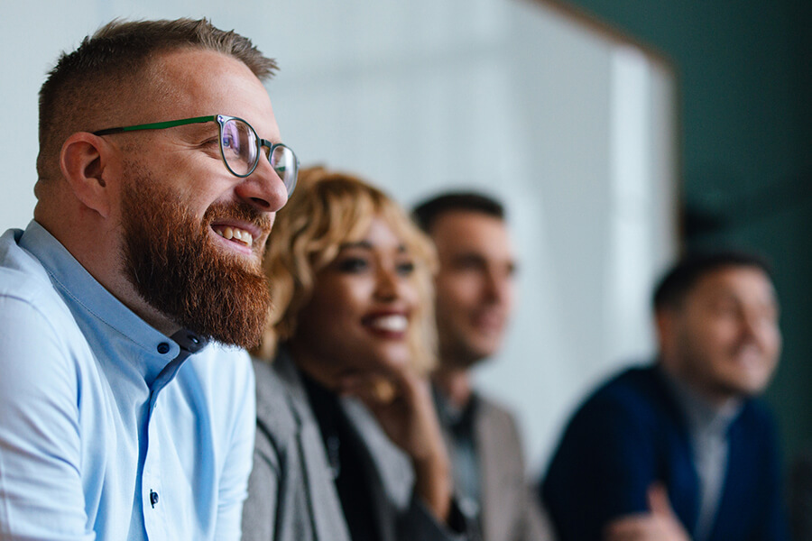 Happy employees in conference room