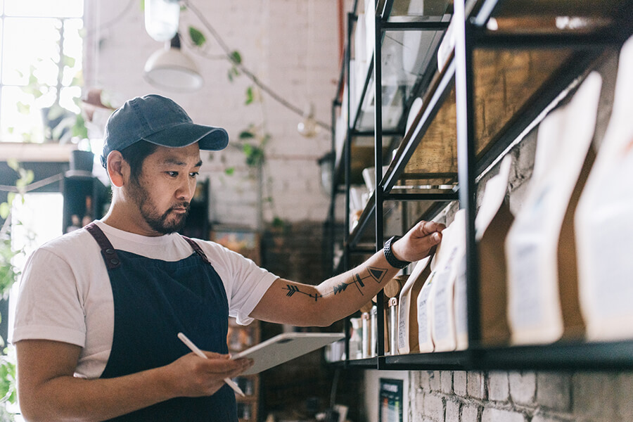 Man doing inventory at coffee business