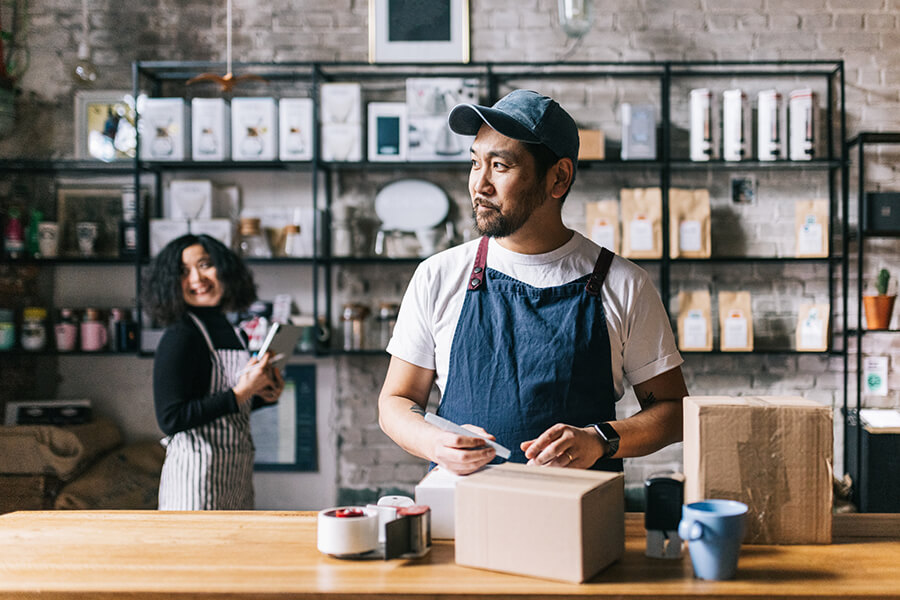 Man filling order at coffee shop