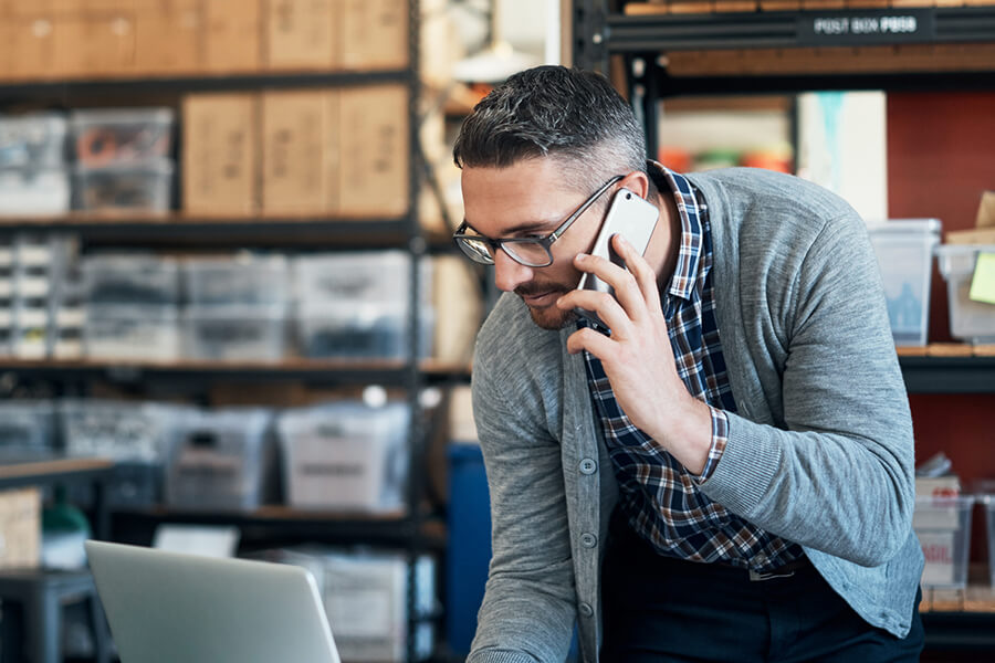 Man on phone in warehouse