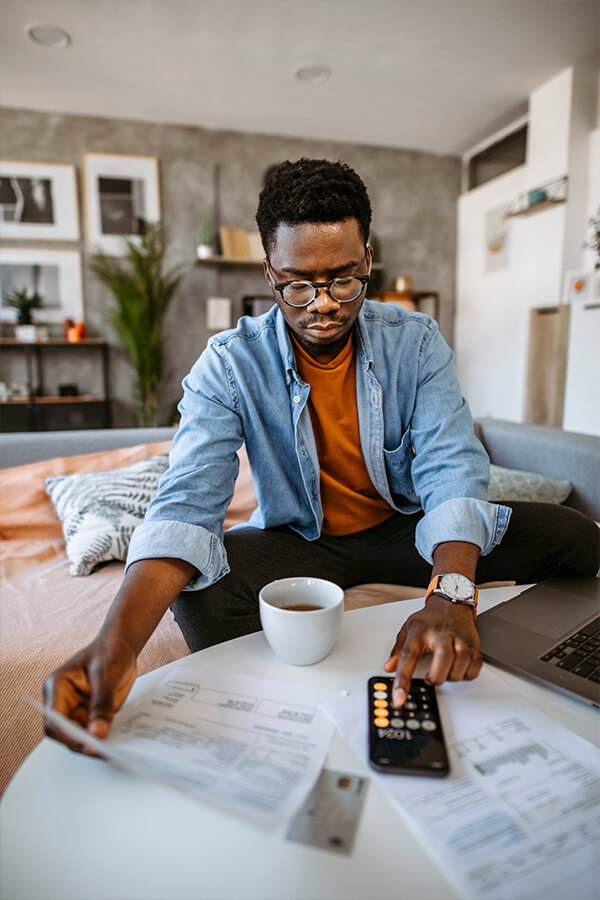Man using calculator on phone 