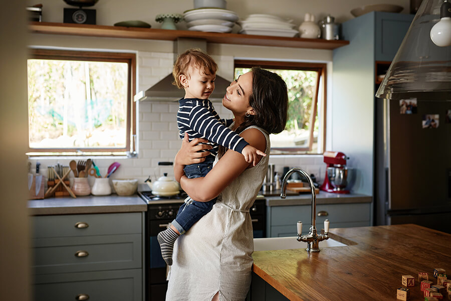 Mother and daughter in home kitchen