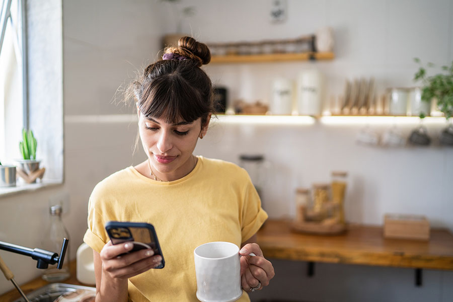 Woman on phone with coffee